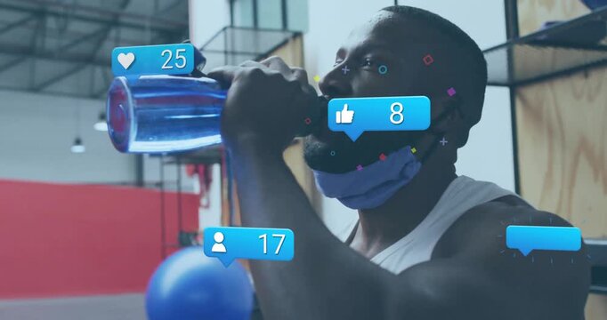 Male fitness enthusiast reaching for bottle and sipping between sets with animated likes floating