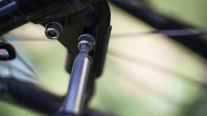 Middle Aged Man Repairing Bicycle at Home
