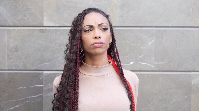 A Confident Fashion Model Striking a Pose Against a Stylish Modern Background Setting