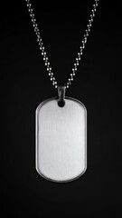 Shiny metal dog tag on a dark background, symbolizing military service or personal identification, with a reflective surface.