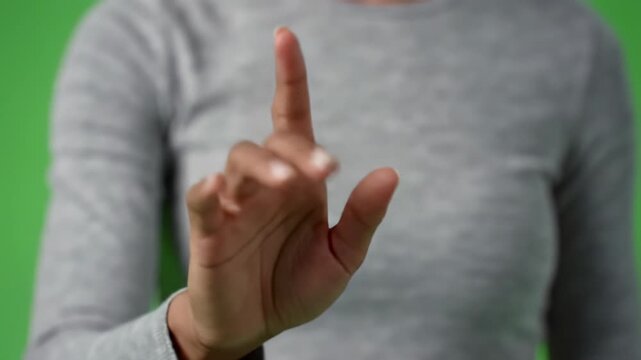 A modern female hand with medium skin tone, clean manicured nails, performs precise multi-touch gestures like taps, swipes, and pinches on a green screen background, showcasing effortless digital