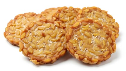 Three cookies with nuts on a white surface viewed from above