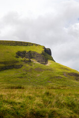 a view from the valley up to the peak of the famous ben bulben mountain in sligo at a cloudy summer day, ireland
