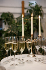 Pouring sparkling wine or champagne served for Christmas or New Year eve celebration.