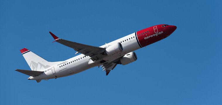 Tenerife, Spain january 7 st, 2026. Boeing 737 MAX 8 Norwegian Airlines flies in the blue sky. Takeoff at Tenerife Airport