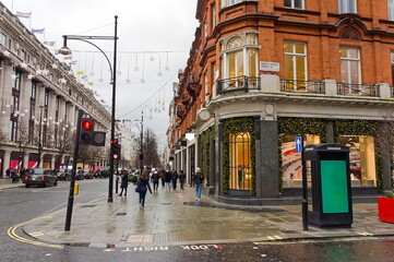 The corner of North Audey street and Oxford st. with people in the distance on a wet day in...