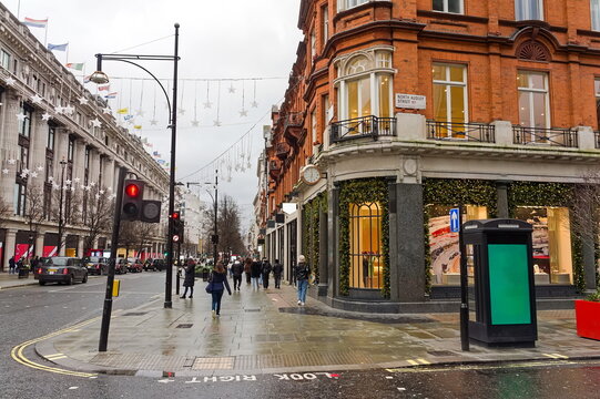 The corner of North Audey street and Oxford st. with people in the distance on a wet day in Westminster London UK. 