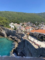 Beautiful coastal town with stone buildings and turquoise sea water