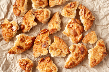 Broken cookies. Cookie pieces on crumpled paper. Top view