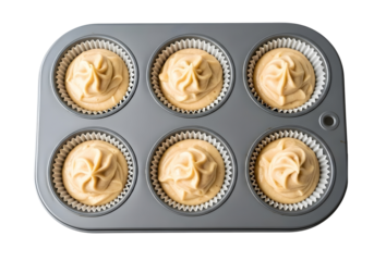 Muffin tin with six cupcakes filled with creamy frosting isolated on transparent background