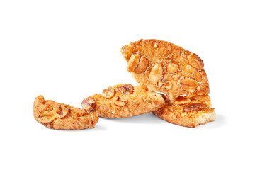 Broken cookies. Close-up of pieces of cookies with nuts isolated on a white