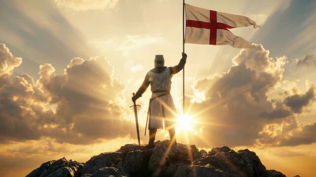 Silhouette of a medieval knight in armor standing on a rocky peak with a sword and St. George's flag. Heroic warrior against a dramatic sunset sky with sun rays. Victory and conquest concept