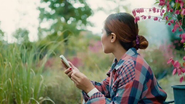 Woman Using Smart-phone in Garden