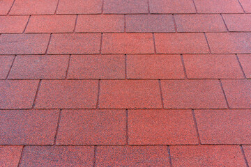 Obraz premium Red Bituminous Roof Shingle Texture Background with Granular Surface