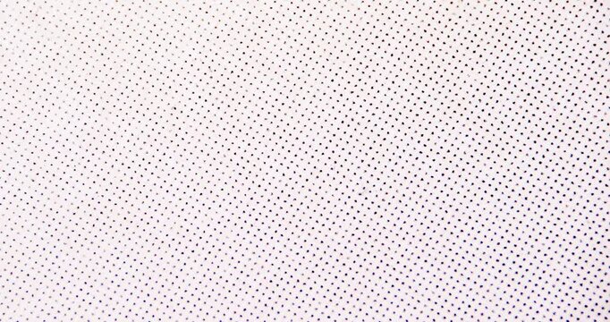 Macro close-up of printed halftone CMYK dot pattern on fibrous paper surface. Abstract vintage print texture background with subtle dust, speckles and paper grain.