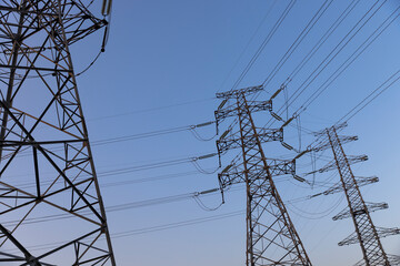Electricity pylon against a blue sky