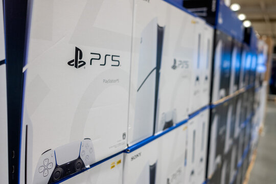 Stacked Sony PlayStation 5 or PS5 Boxes on Store Shelf