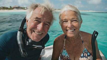 Happy senior couple snorkeling in turquoise ocean waters. Active lifestyle, enjoying retirement together. Wonderful vacation, travel adventure. Smiling faces, positive vibes.