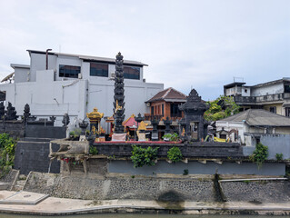 The Hindu place of worship building is flanked by buildings