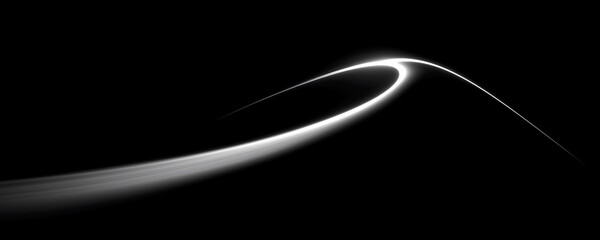 Fototapeta premium Abstract curved light trail on a black background, conveying motion, flow, elegance, and futuristic energy with a minimalist, modern aesthetic.
