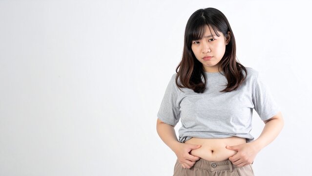 自分の体型を気にする女性 イメージ