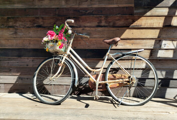 old bicycle in front of a wall