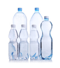 Naklejka premium Water bottles of different sizes isolated on white