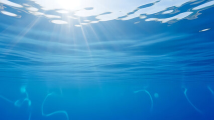 Serene underwater scene with sunbeams shining through ocean surface
