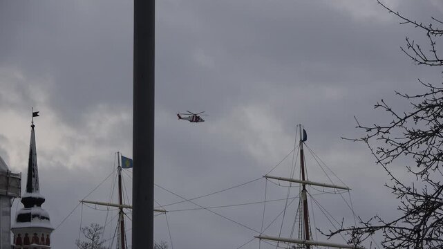One rescue helicopter is flying over central Stockholm Sweden