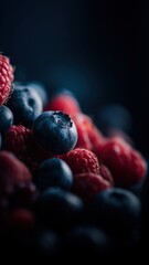 Close-up of fresh blueberries and raspberries with vibrant colors and moody lighting, perfect for commercial food, fragrance, or healthy lifestyle campaigns