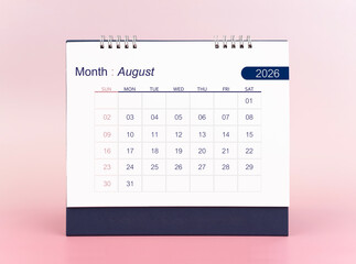 August 2026 blank desk calendar on pink background.