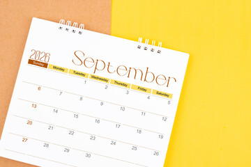 September 2026 desk calendar on brown and yellow, Planning for business.