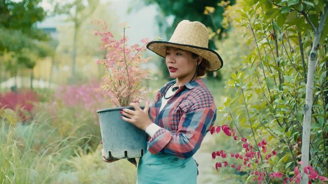 Woman with potted plant in a vibrant garden