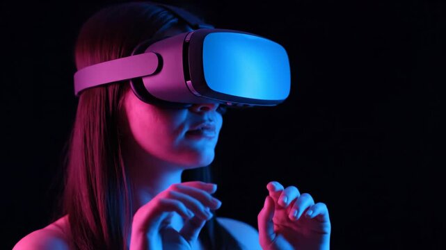 Woman in VR headset with blue and pink neon lighting, reaching out with hands.