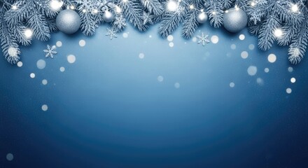 Christmas tree branches with ornaments and lights against a blue background.