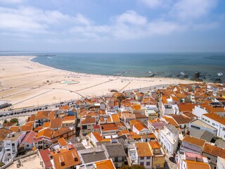 Aerial view of the beach of Figueira da Foz and the city, It is a coastal city with several beaches, summer and seaport facilities on the Atlantic Ocean coast.  © yujie