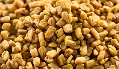 Background of fenugreek seeds in closeup