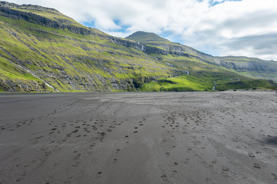 Saksun village and Waterfall - Faroe Islands. Black sandy beach