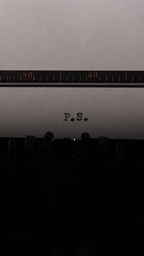 Vertical video old typewriter carriage with white paper showing typed p.S. Nostalgic postscript signaling a final personal afterthought