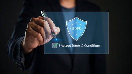 Businessman touching virtual screen with GDPR shield icon and checkbox. Concept of General Data...