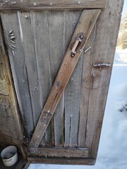 Traditional rural outbuilding entrance in cold winter season