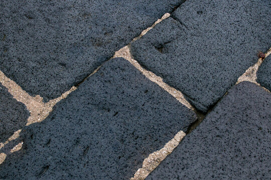 Lava Stone TilesVolcanic Lava Paving Tiles. Natural, durable paving. Features a unique black texture. Made from lava stone. Organic materials. Creates a durable surface.