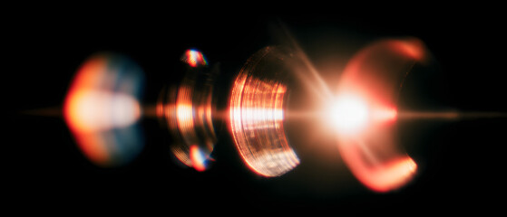 Vintage film projector casting light leaks and grain on a textured wall retro technology creative composition