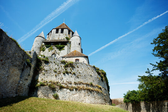 Majestic stone castle Caesar tower against a bright sky, Provins