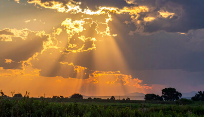 Sunlight rays sunset orange yellow clouds sky beam evening glow atmosphere shining bright nature light weather heaven dusk scenery golden hour generative AI