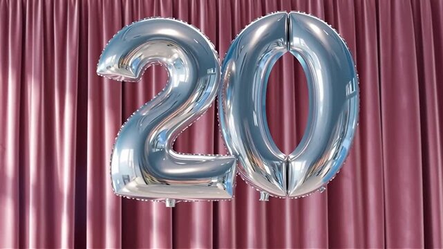 Shiny silver foil balloon number twenty rising into frame against a rich satin curtain backdrop, catching soft highlights and casting gentle shadows
