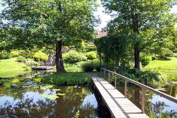 Bridge to the gazebo on the island. Orekhovno Estate Park. Orekhovno village, Pustoshkinsky District, Pskov Oblast, Russia