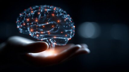 Luminous digital human brain hovering above a hand, representing artificial intelligence, neural processing and advanced data technology.
