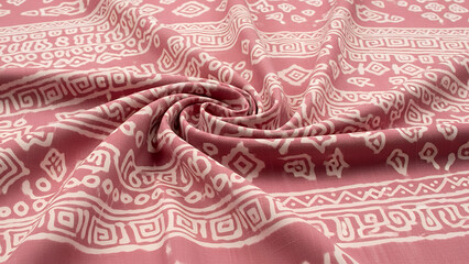 Adire fabric in soft pink tones with delicate patterns showcasing traditional textile design