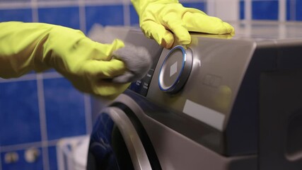 Checking detergent drawer for residue, Detailed view of appliance maintenance steps, Closeup of hands checking for limescale and residue in household appliance drawer